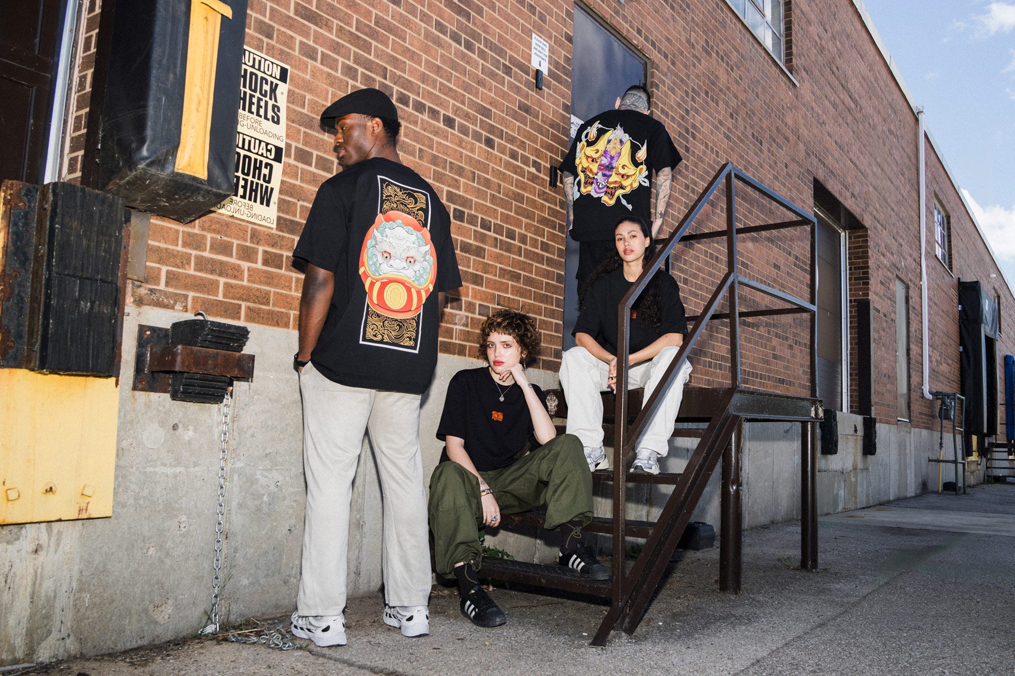 99foxgod shirts group photo in warehouse setting