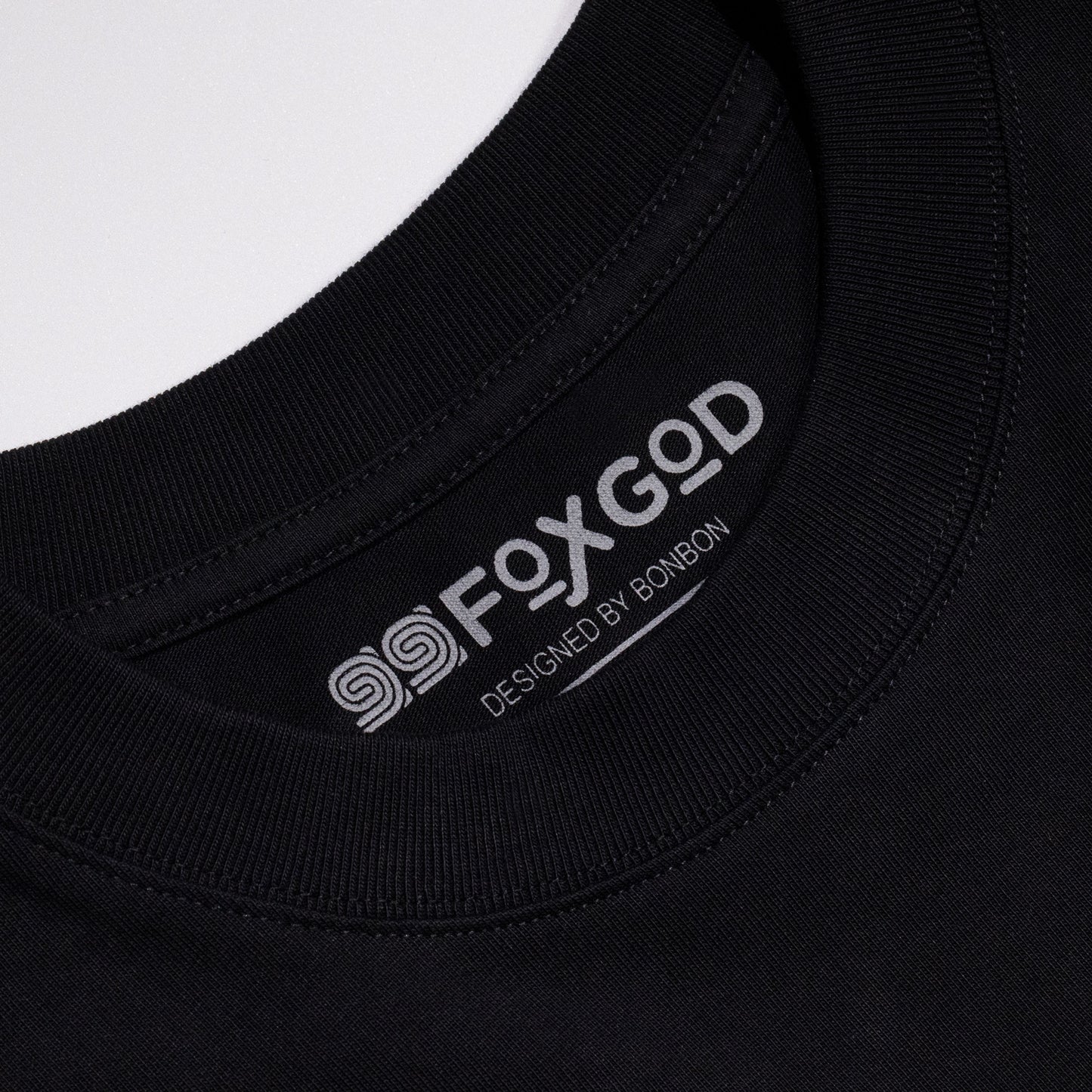 99FOXGOD Designed by Artist BonBon logo on black shirt