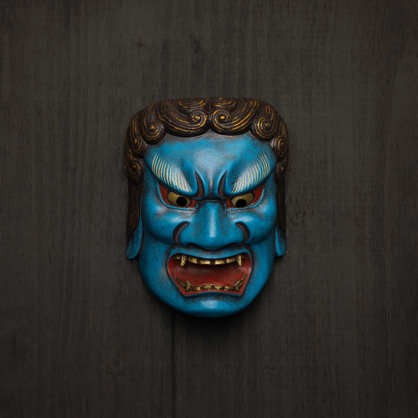 Blue Fudo Myo-o Mask on a wall