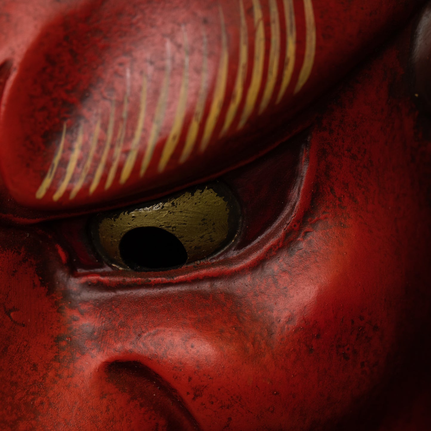 Red Fudo Myo-o Mask close up on eye