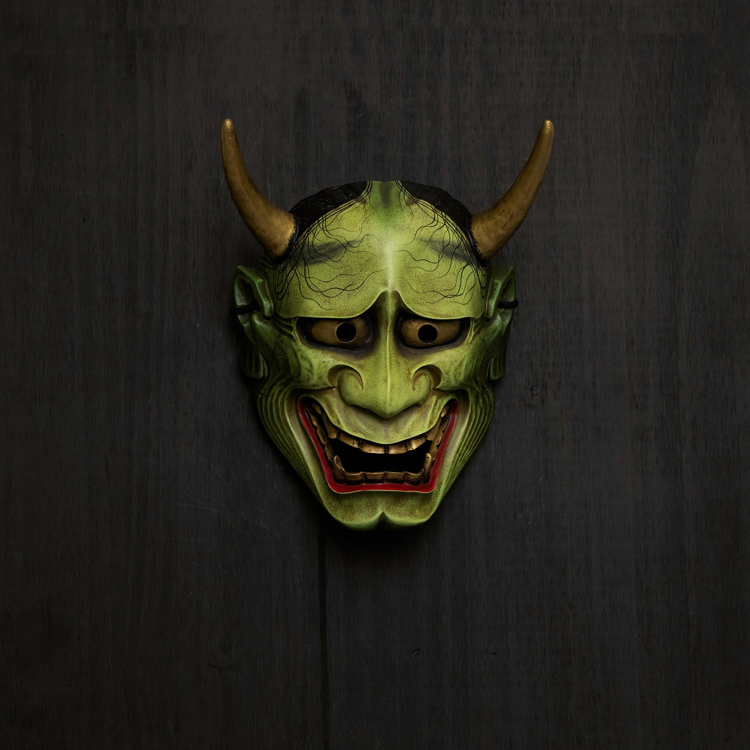 Green Hannya Mask on Wall