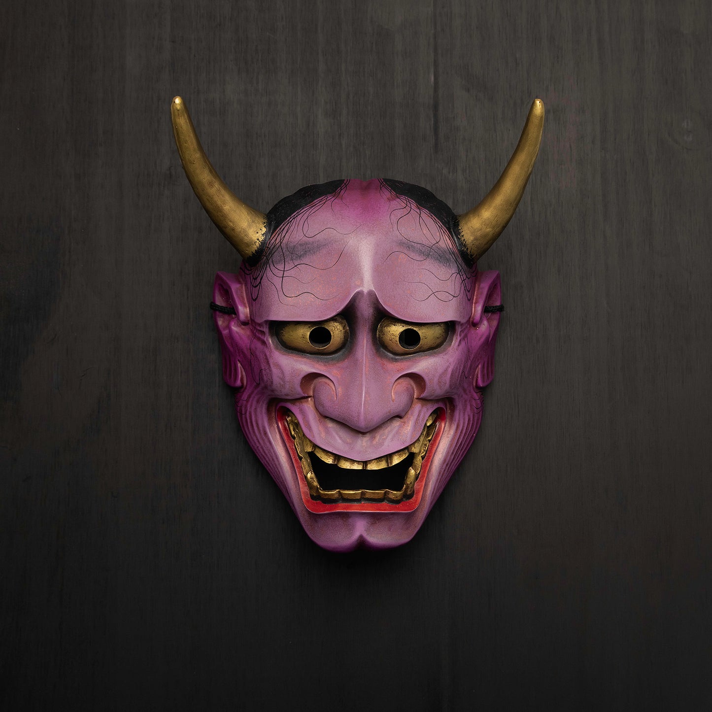 Purple Hannya Mask on the wall