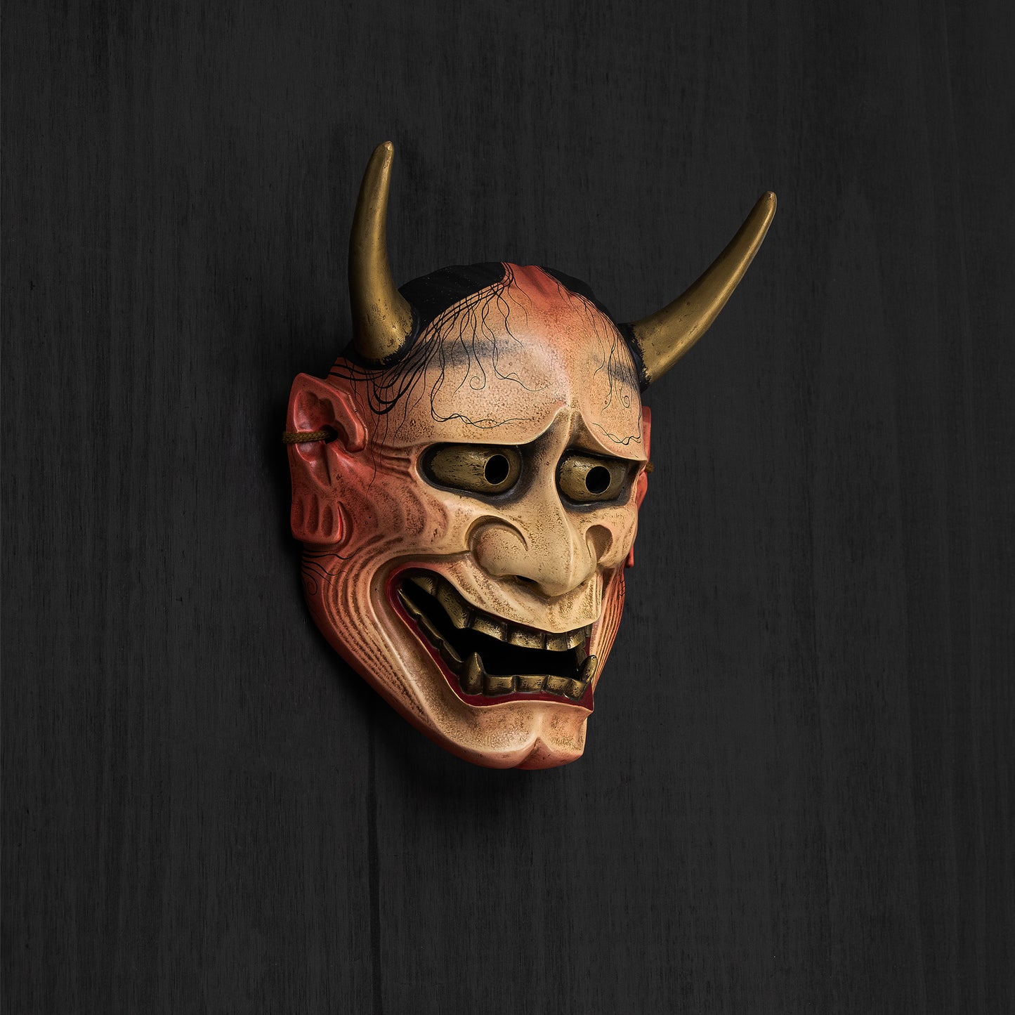 White Traditional Hannya Mask on the wall