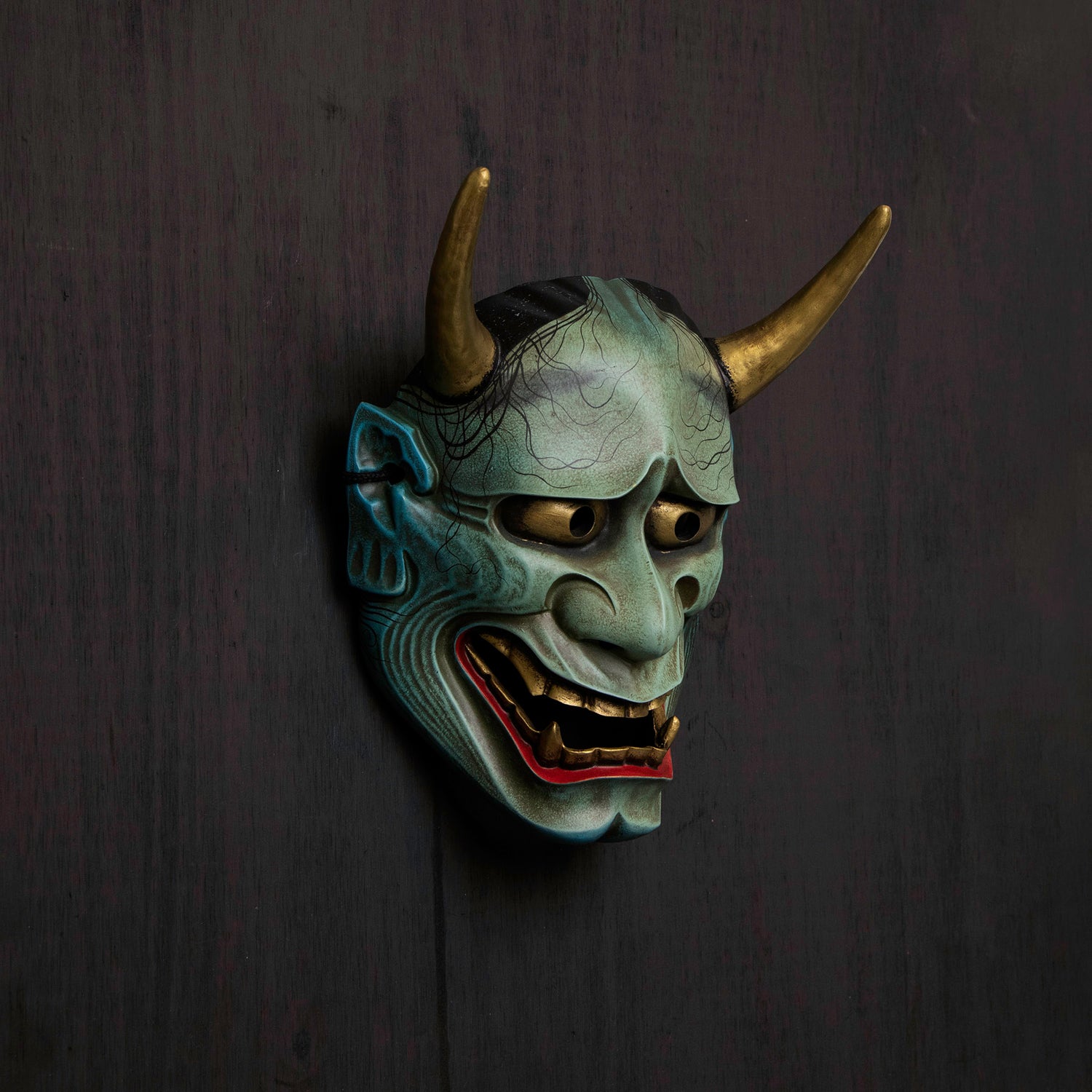 Peacock Blue Hannya Mask on wall