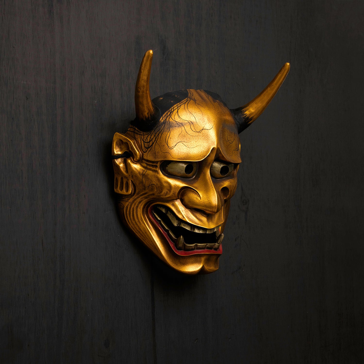 Gold Hannya Mask on wall