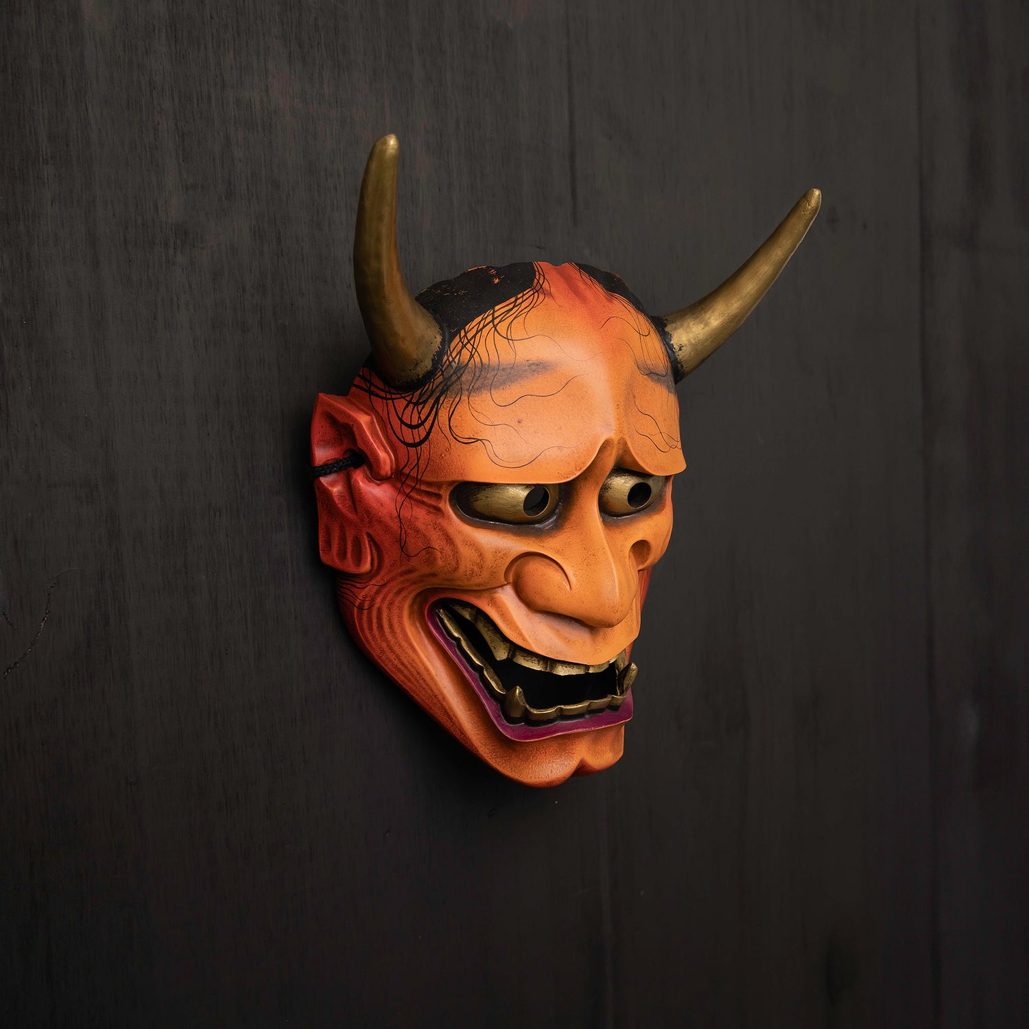 Light Red Hannya Mask on wall