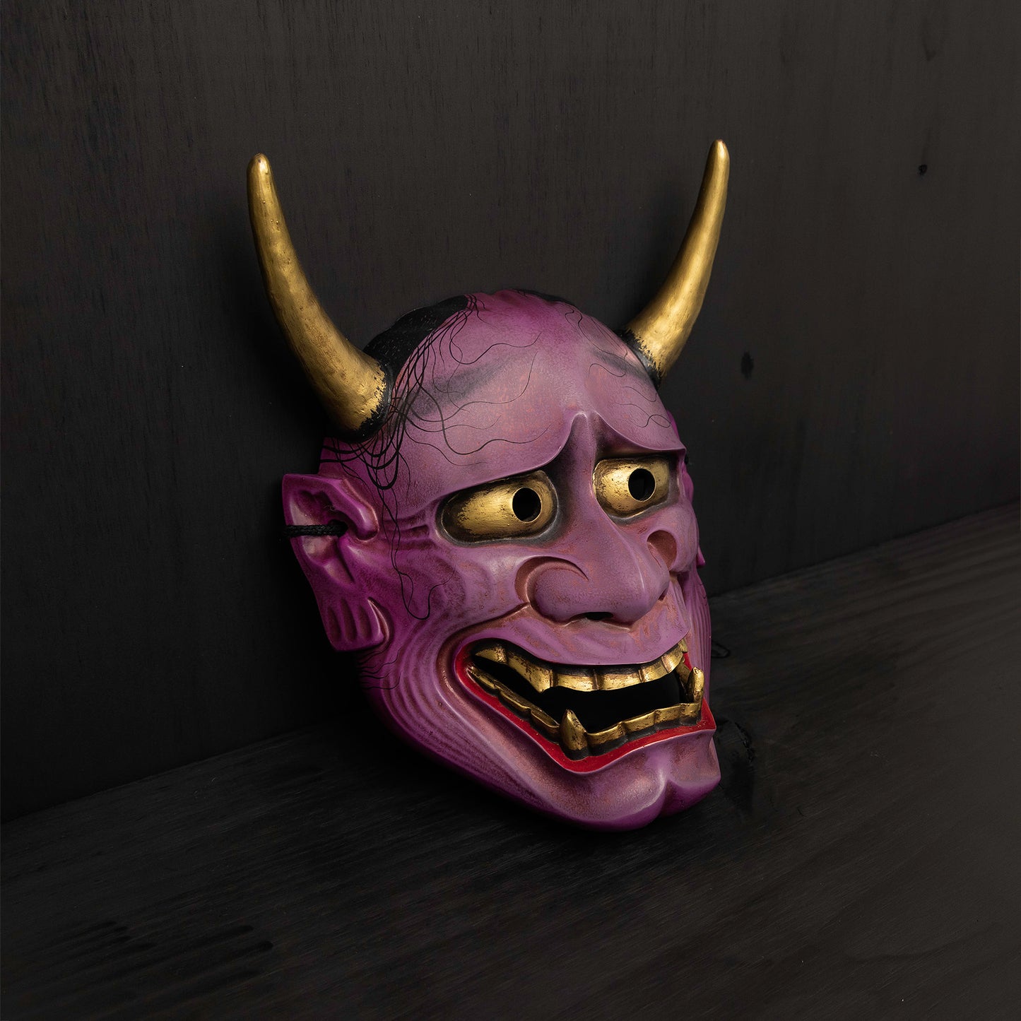 Purple Hannya Mask on the floor