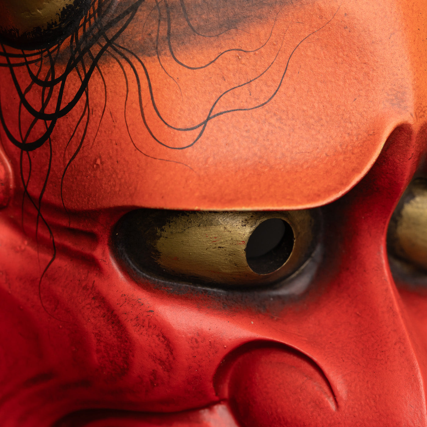 Red Hannya Mask close up on the eye