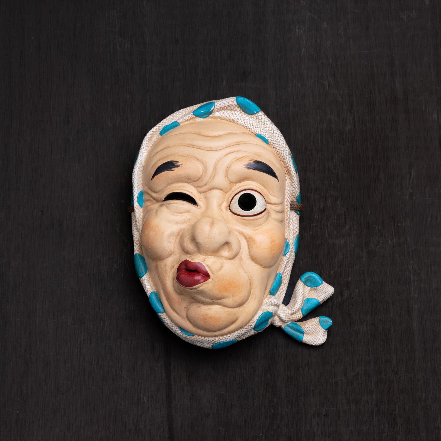 Hyottoko mask.