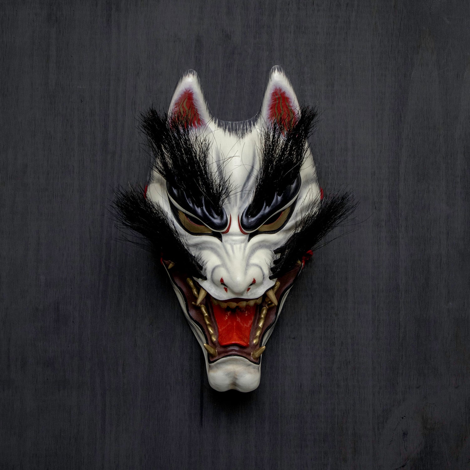 Kitsune Mask displayed on a wall